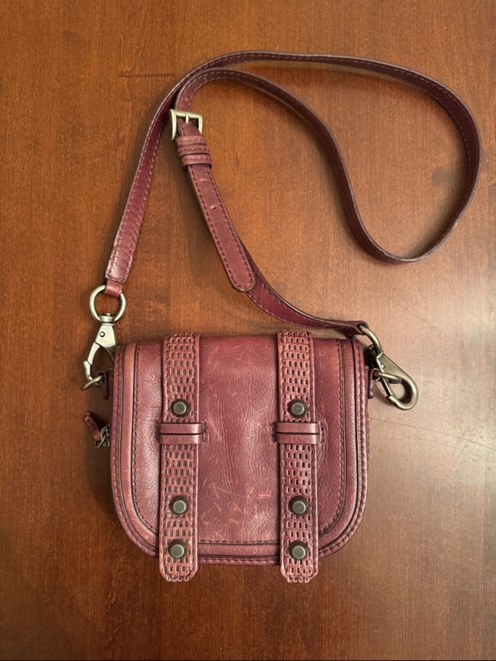 Compact Wine Leather Crossbody Bag with Adjustable Strap